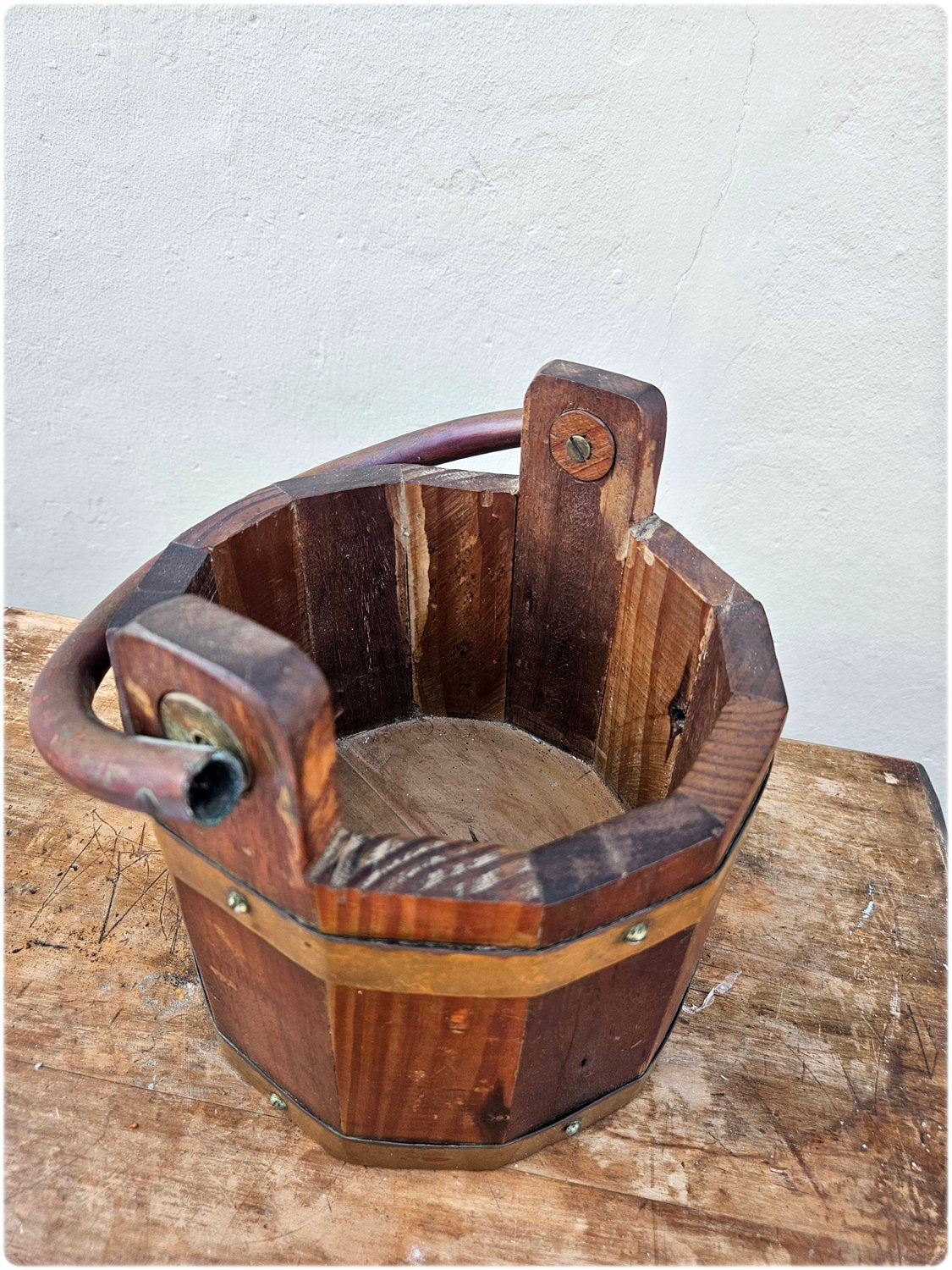 Wooden bucket with copper details