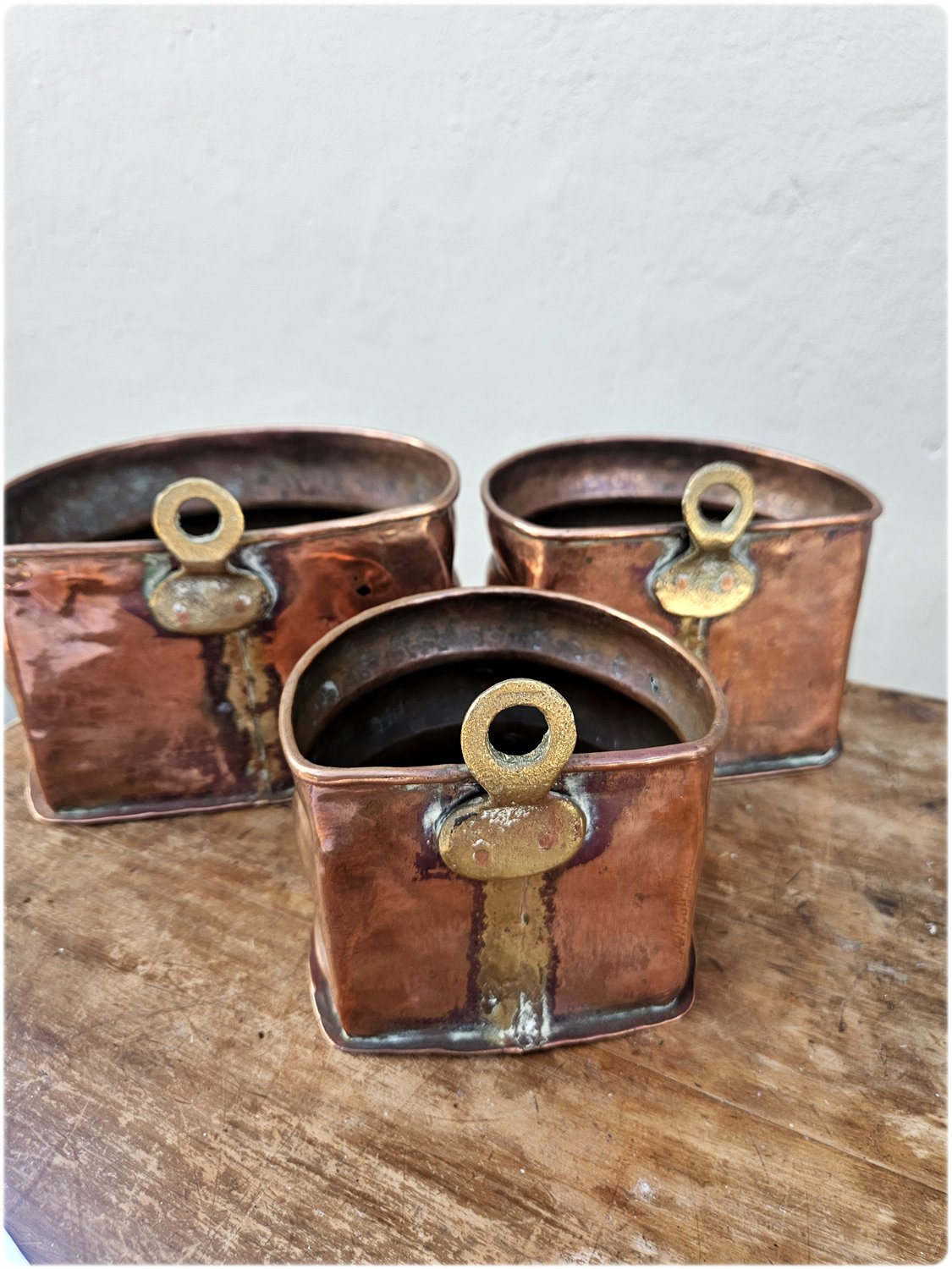 Graduated set of 3 copper and brass wall pocket planters