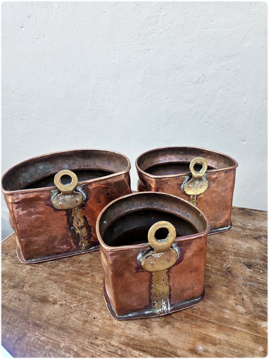 Graduated set of 3 copper and brass wall pocket planters