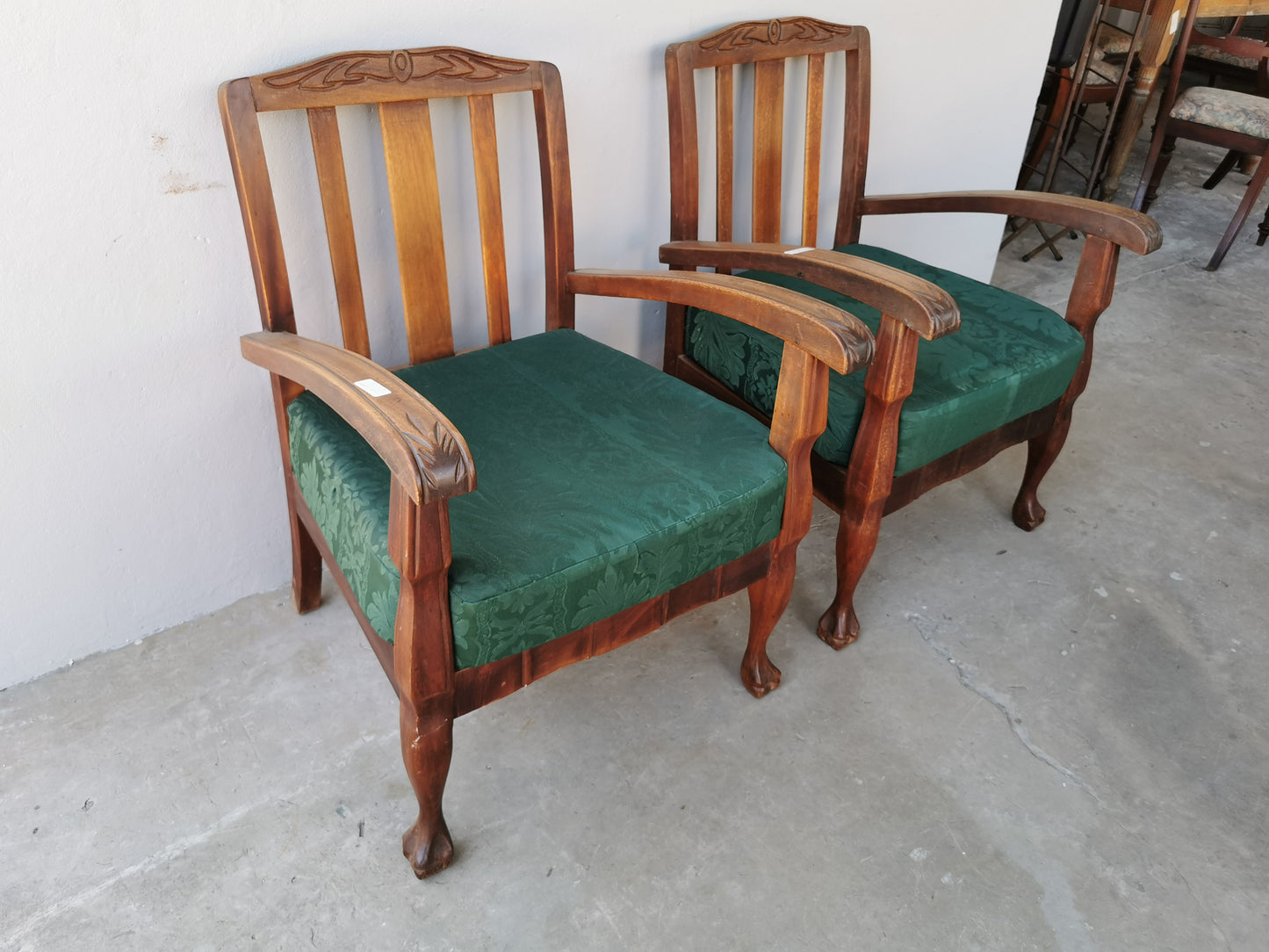 Pair of wooden arm chairs