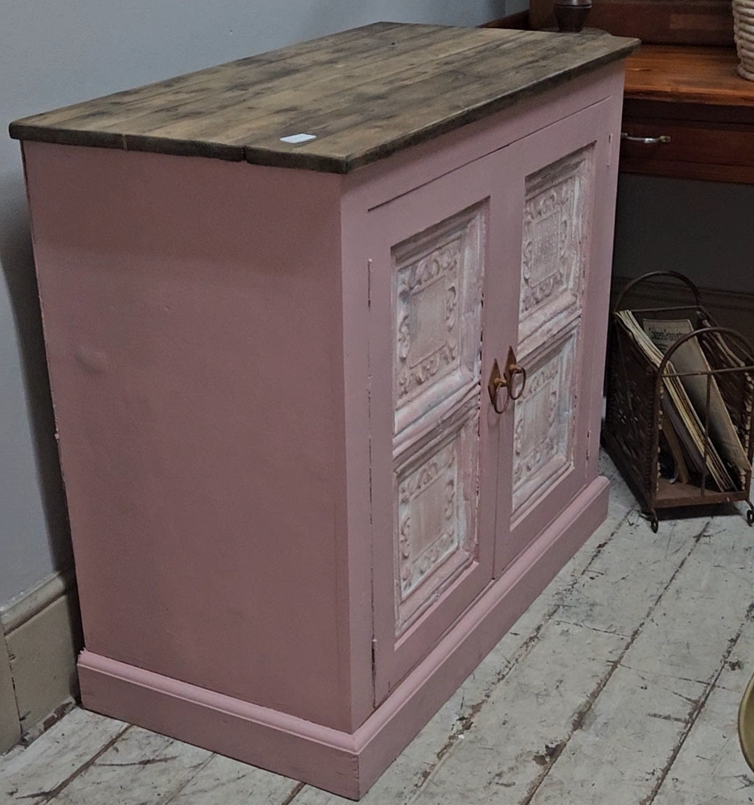 Base cabinet with iron paneled doors