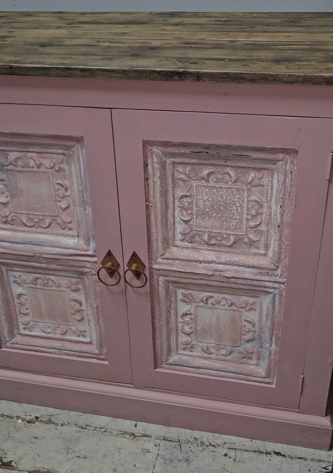 Base cabinet with iron paneled doors