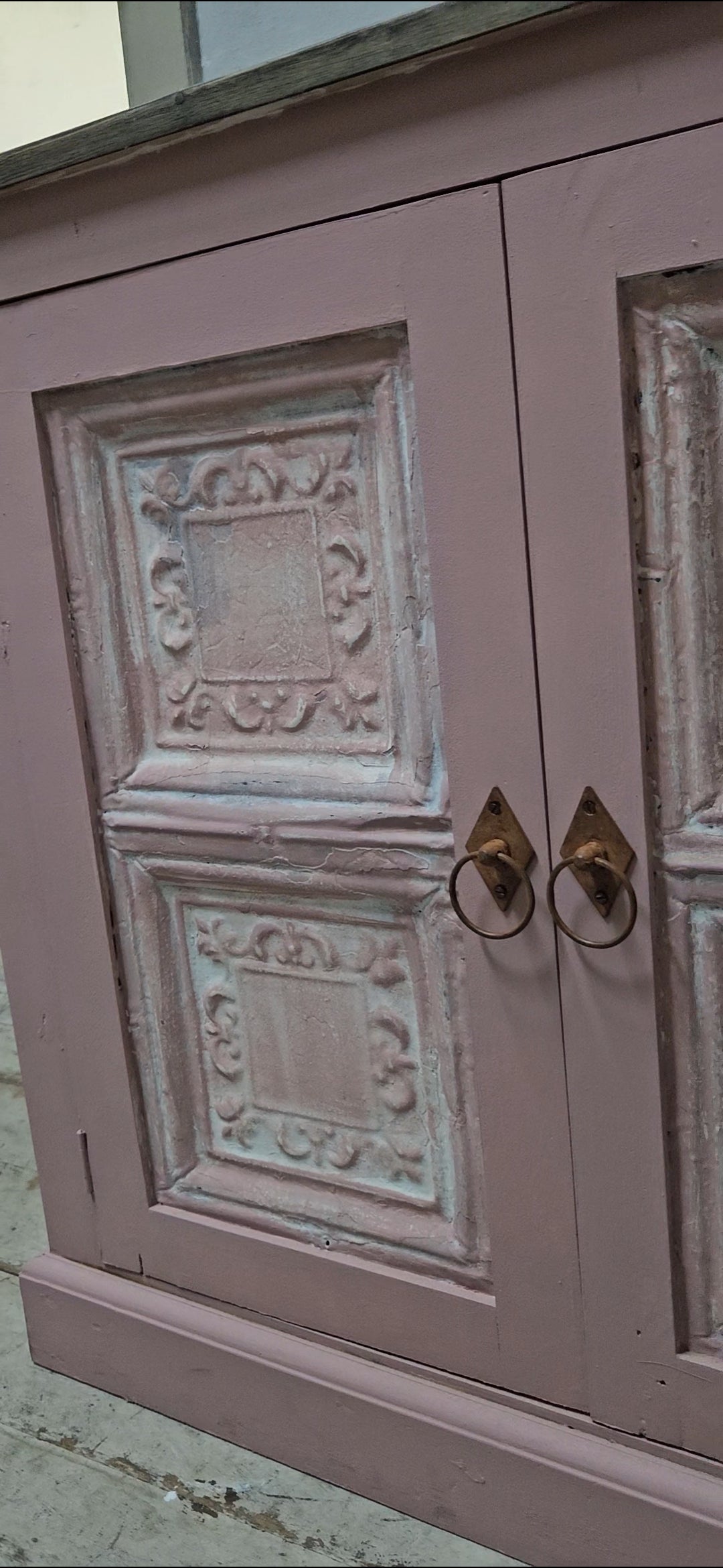Base cabinet with iron paneled doors