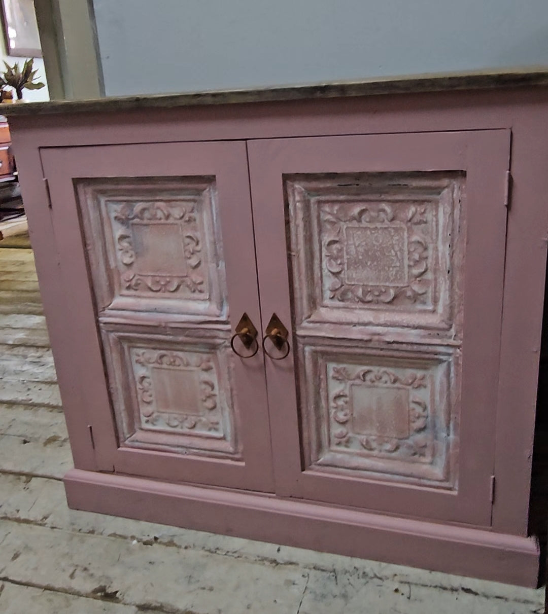 Base cabinet with iron paneled doors