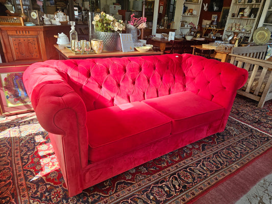 Red Chesterfield style couch
