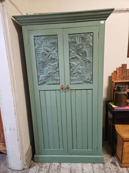 Green cupboard with shelving