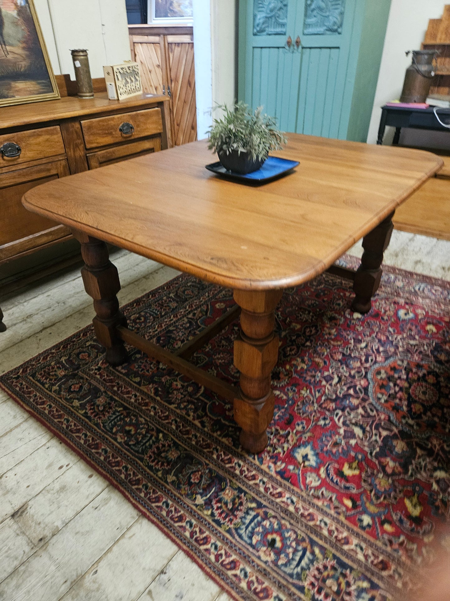 Teak dining table with chunky legs