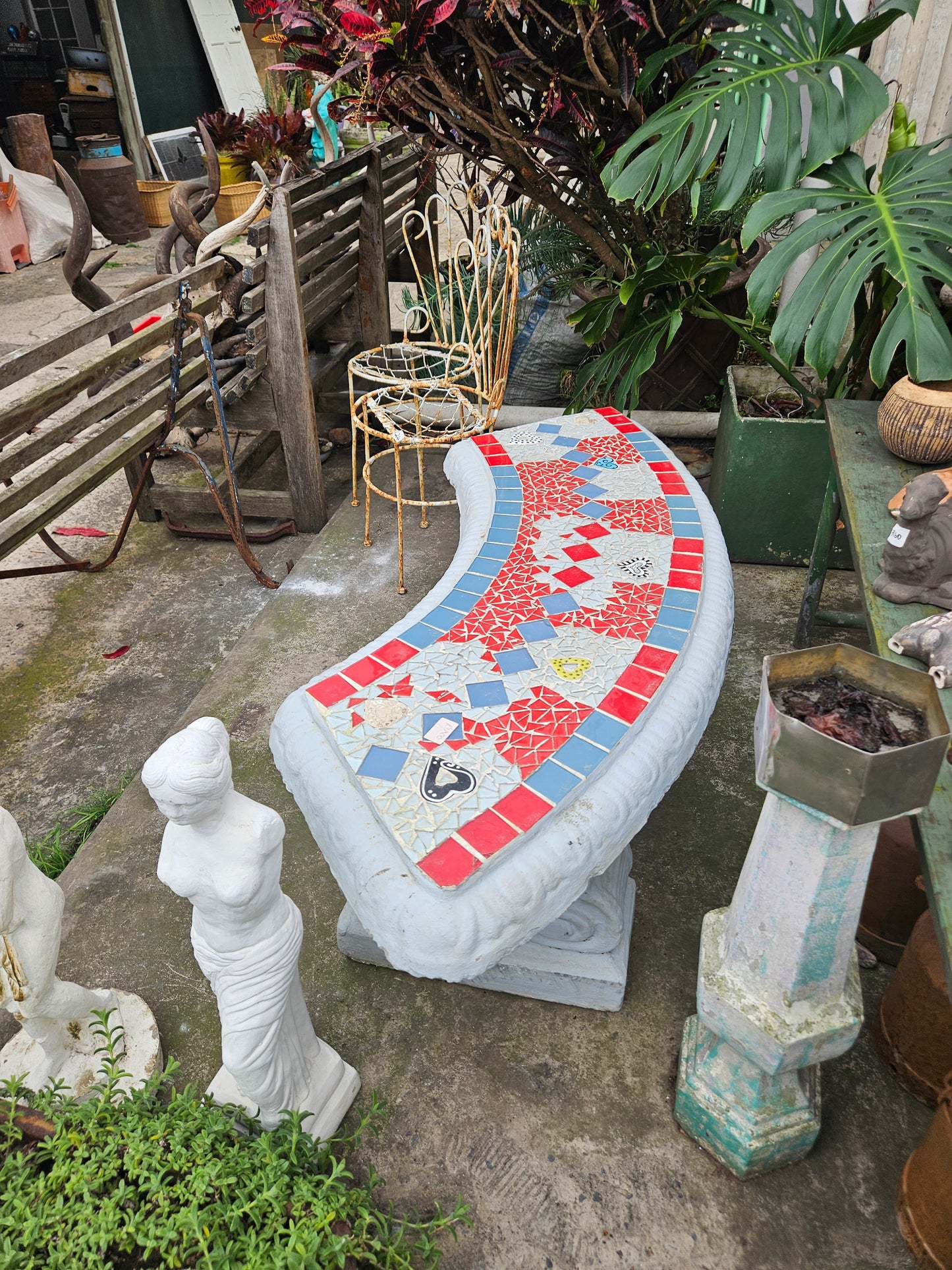 Curved concrete garden bench
