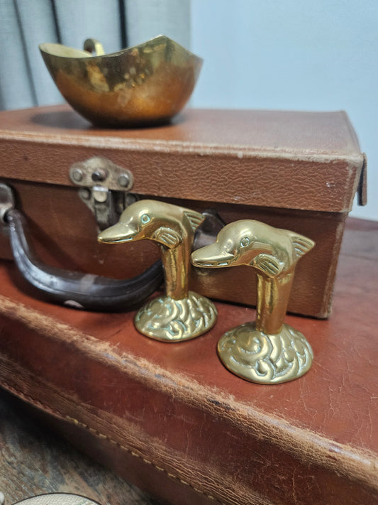 Pair of brass dolphin figurines