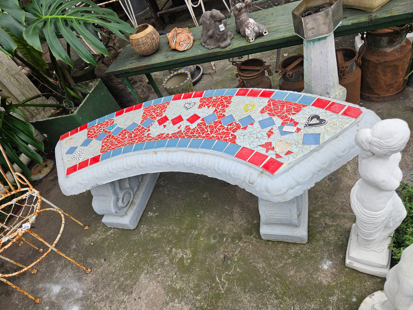 Curved concrete garden bench