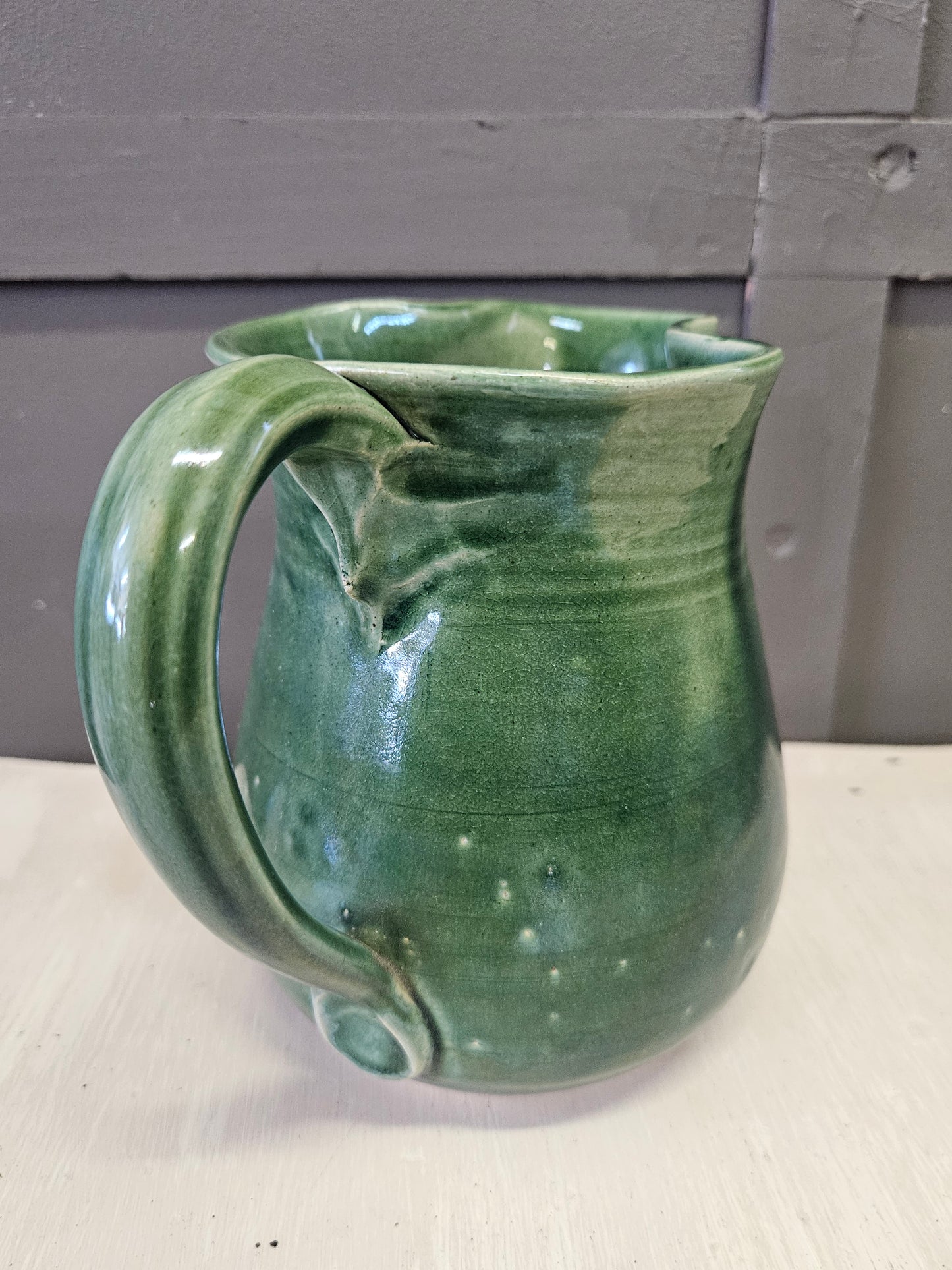 Green pottery jug