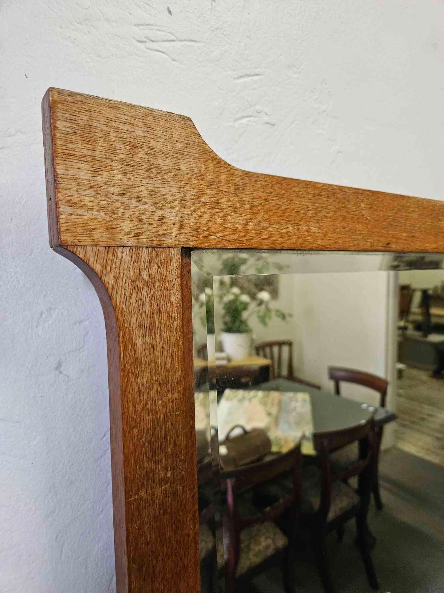 Beveled mirror in wooden frame