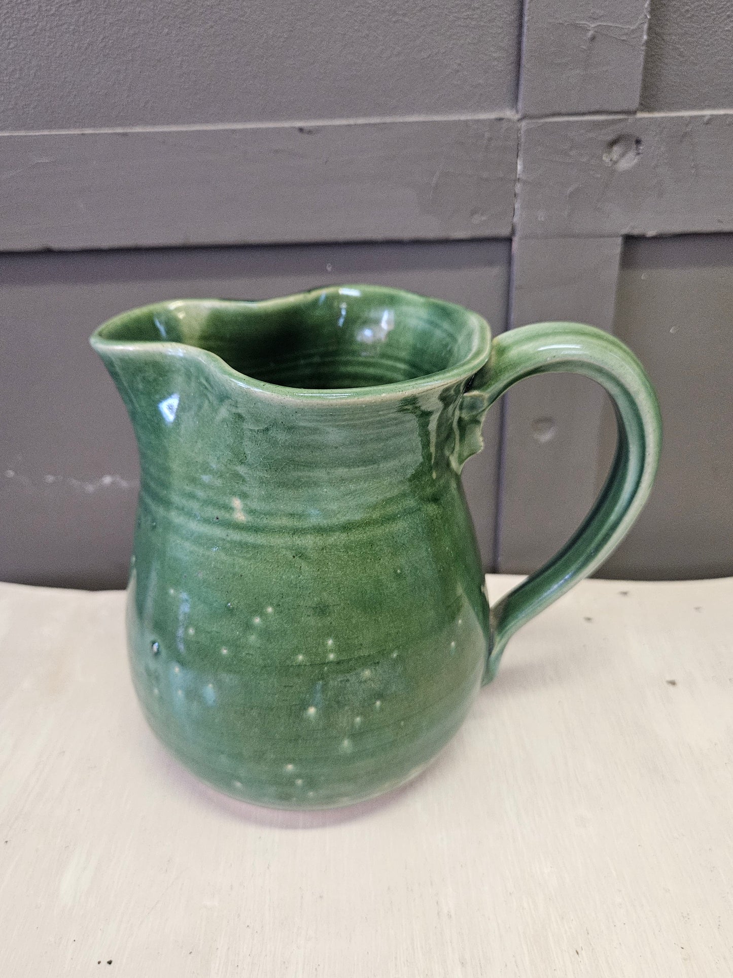 Green pottery jug