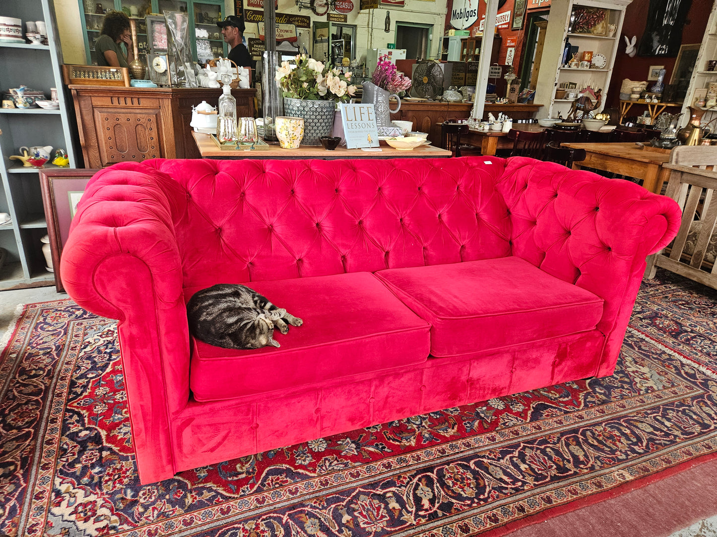 Red Chesterfield style couch