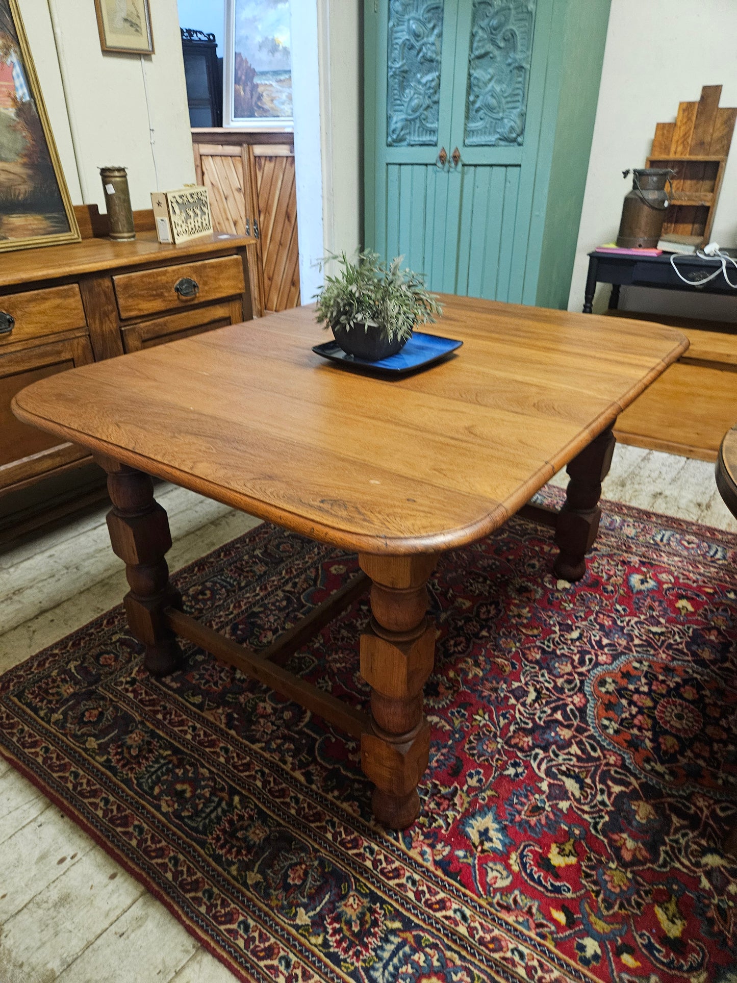Teak dining table with chunky legs