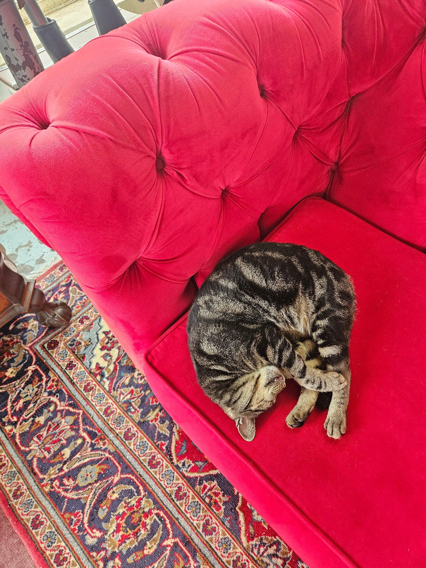 Red Chesterfield style couch